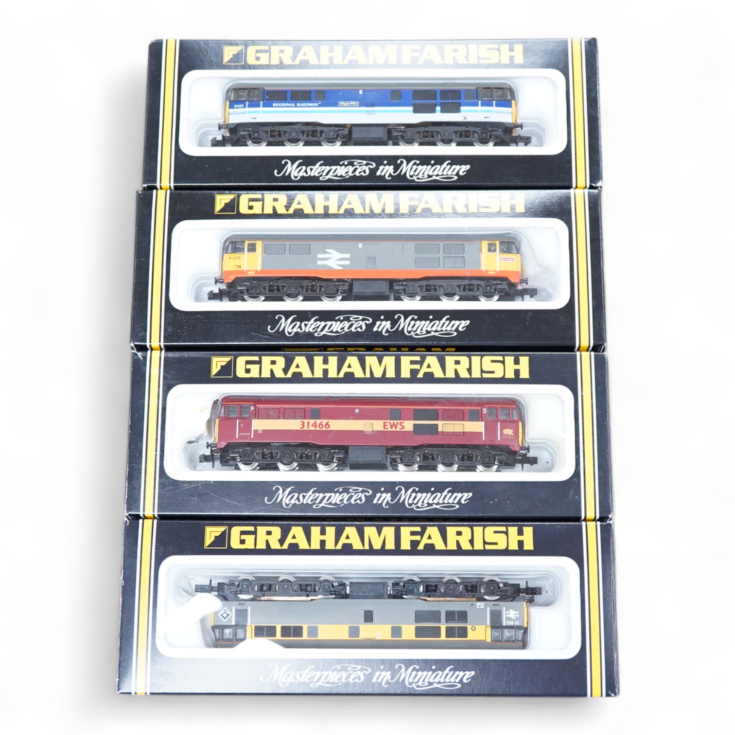 Four boxed Graham Farish N gauge railway Class 31 Co-Co diesel locomotives; a BR, 31 552 (806A), an EWS, 31 466 (806B), a BR, 31 205 (8066) and a Regional Railways, 31 421 (8067).